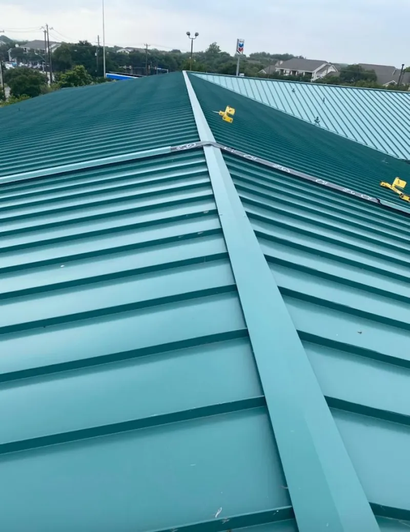 Green commercial metal roof ridge and valley for Metal Roof Repair in Old Jamestown
